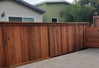 Backyard renovation featuring a new wooden fence in La Canada Flintridge.